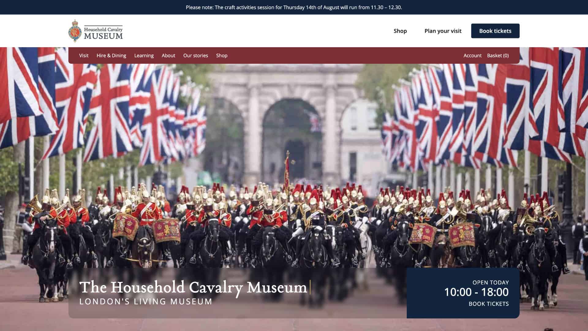 A parade of Household Cavalry soldiers on horseback proceeds along a street lined with Union Jack flags, highlighting the rich British history celebrated at the Household Cavalry Museum. Museum website information is overlaid. | Rubber Duckers